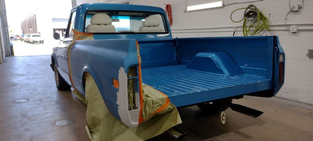 Blue Chevrolet C10 bed repainted, masking still on