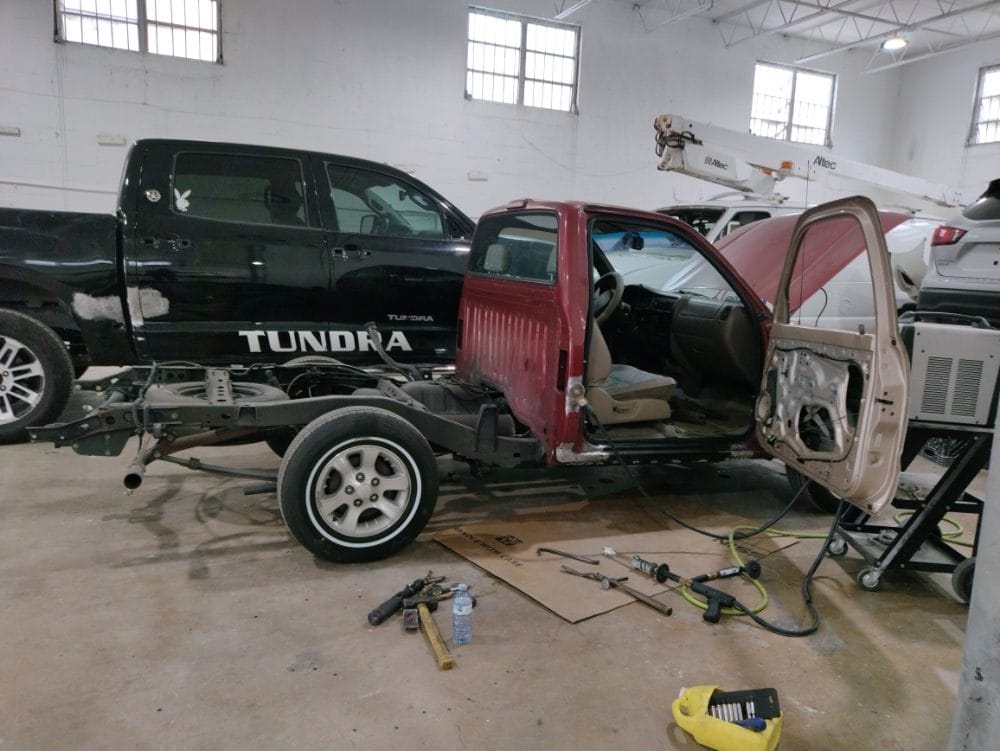 The Auto Shop Repair shop floor with trucks in progress