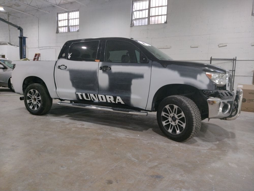 Tundra in primer patches before paint